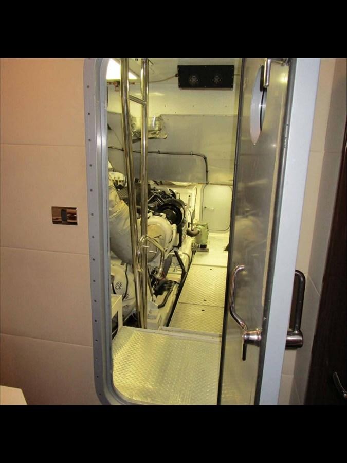 a mirror showing a person sitting in a chair aboard MOJO II Yacht for Sale