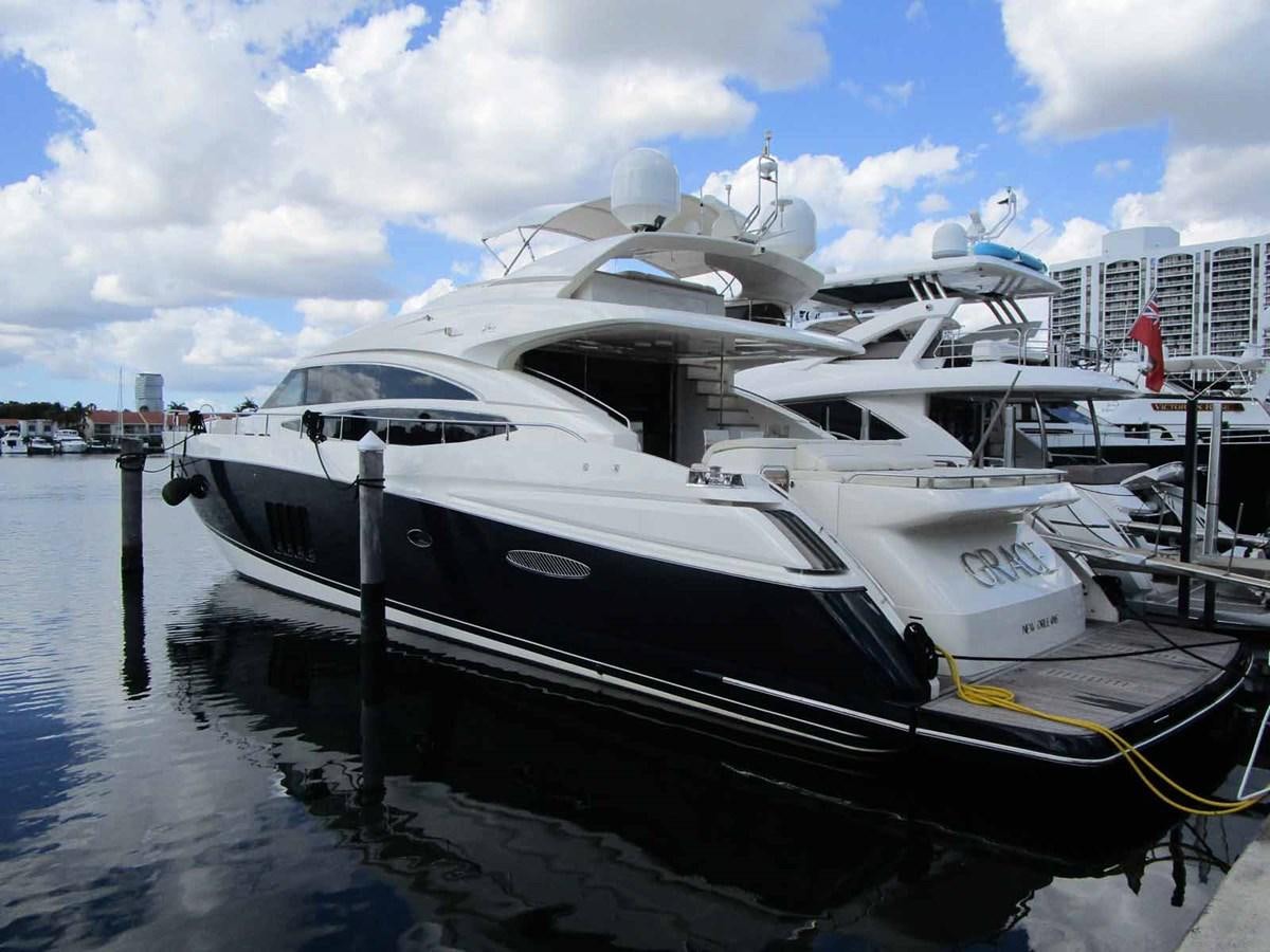 a boat docked at a pier aboard MOJO II Yacht for Sale