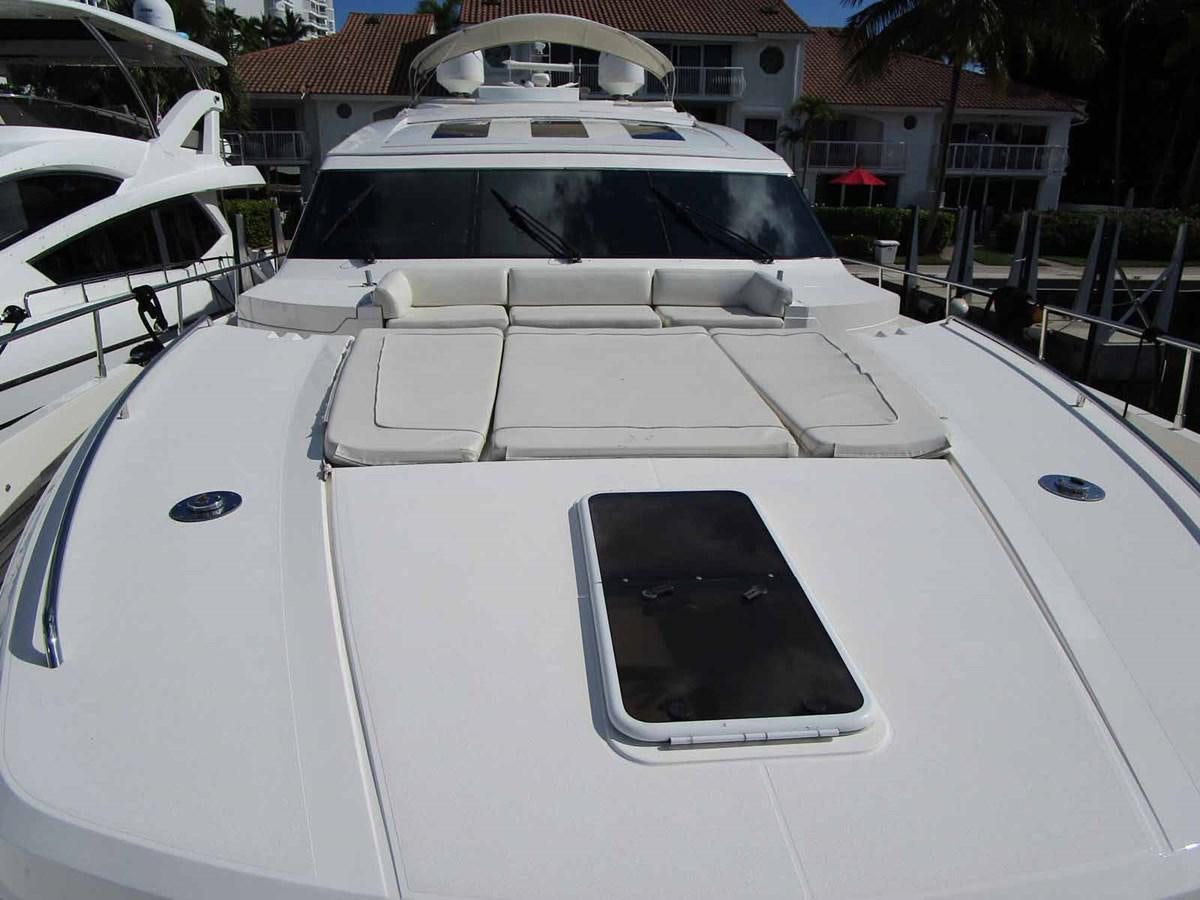 a white car with a screen aboard MOJO II Yacht for Sale