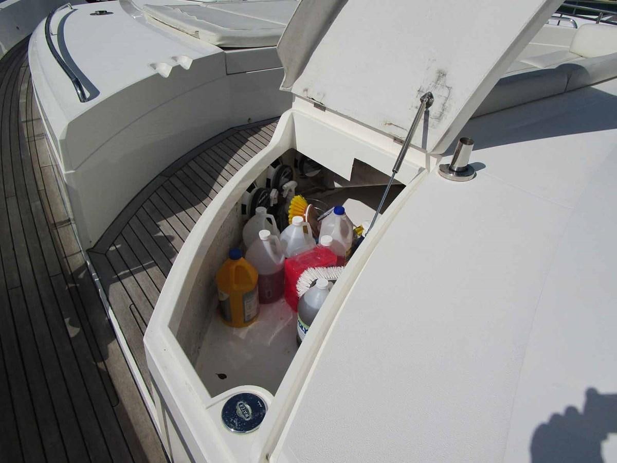 a white car with a door open aboard MOJO II Yacht for Sale