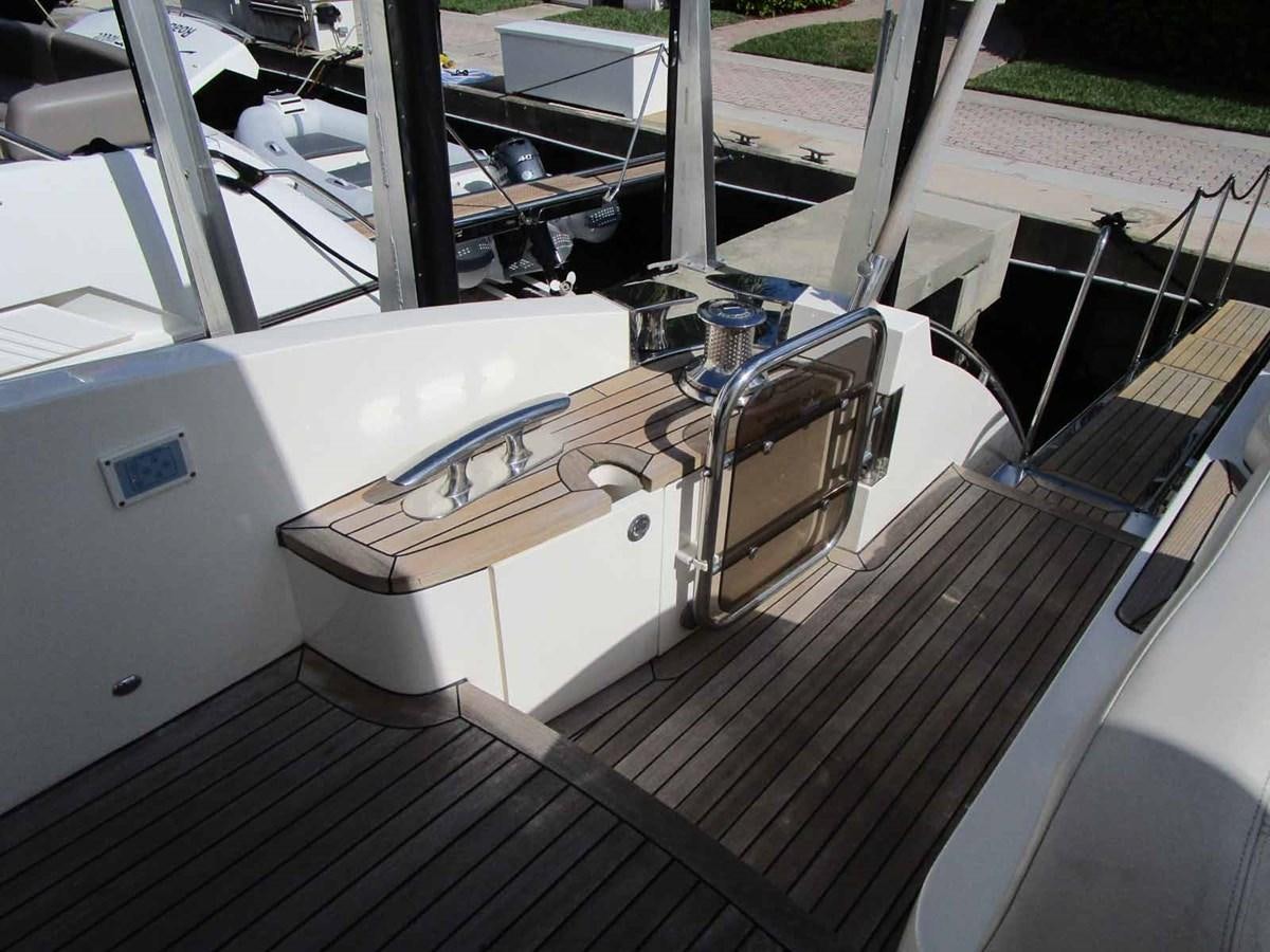 a large white machine on a deck aboard MOJO II Yacht for Sale