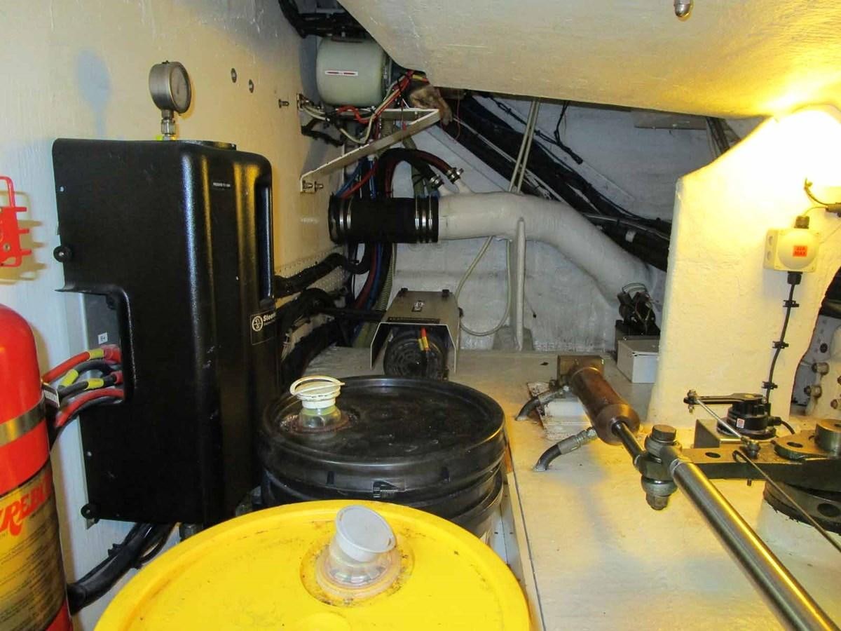 a machine with a large metal cylinder aboard MOJO II Yacht for Sale