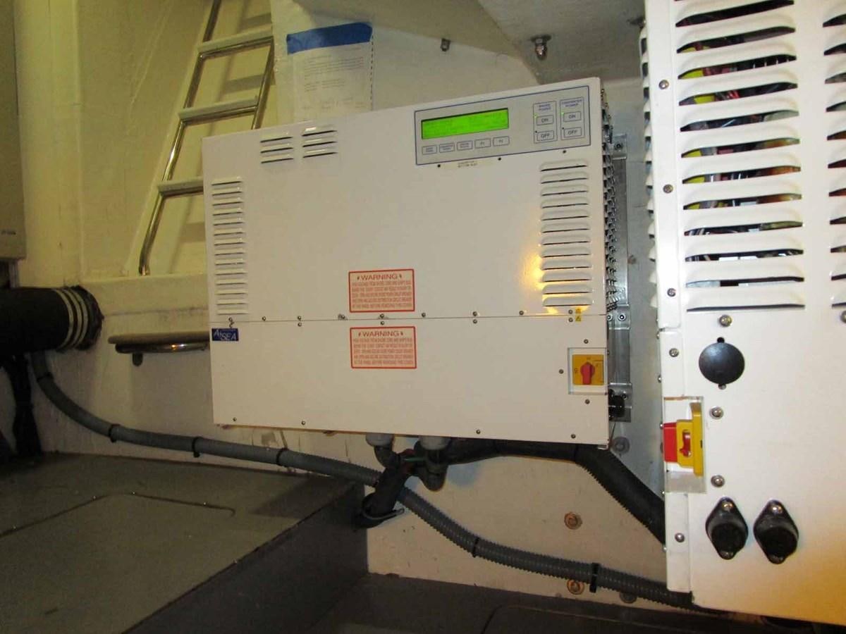 a white machine with a red label aboard MOJO II Yacht for Sale