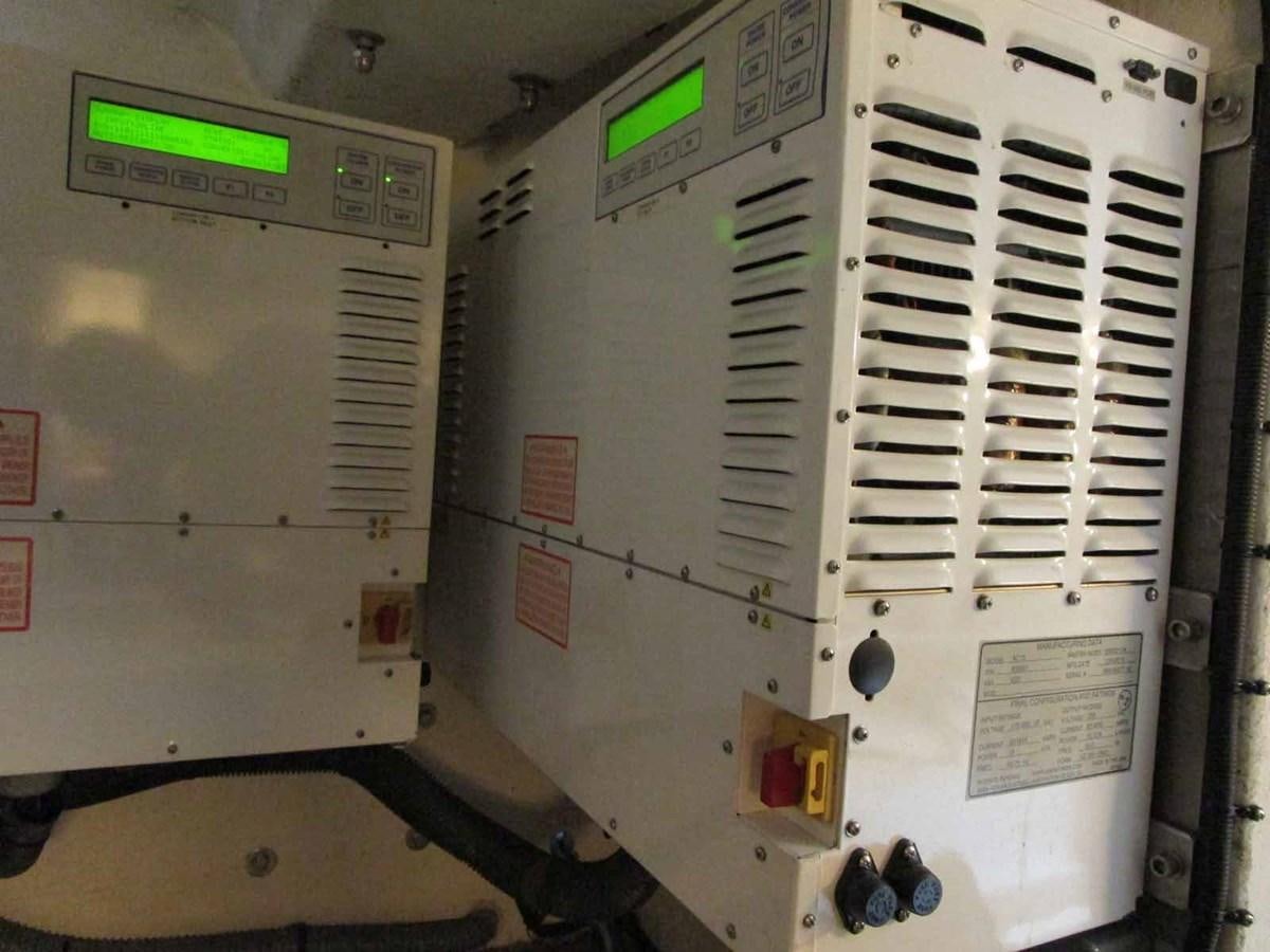 a white machine with green lights aboard MOJO II Yacht for Sale