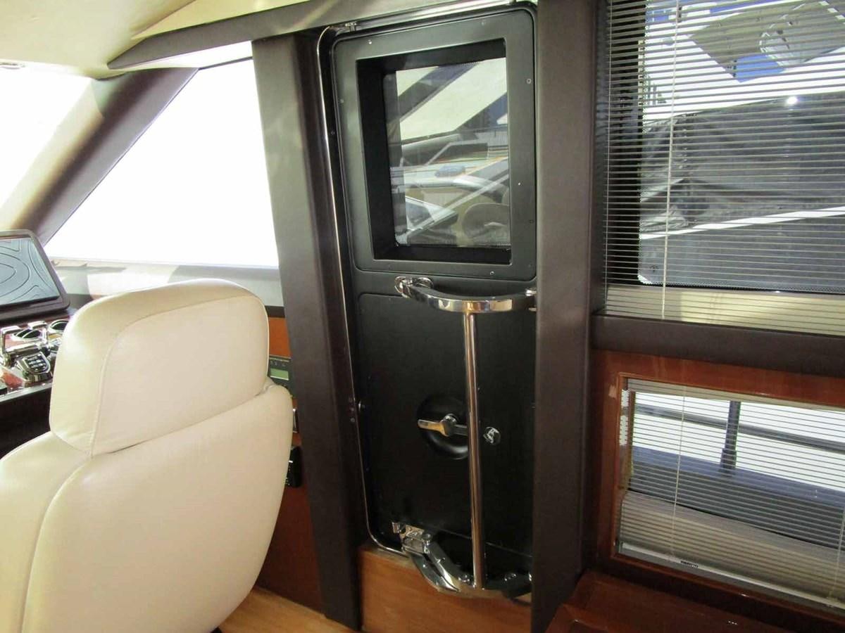 a door with a handle aboard MOJO II Yacht for Sale