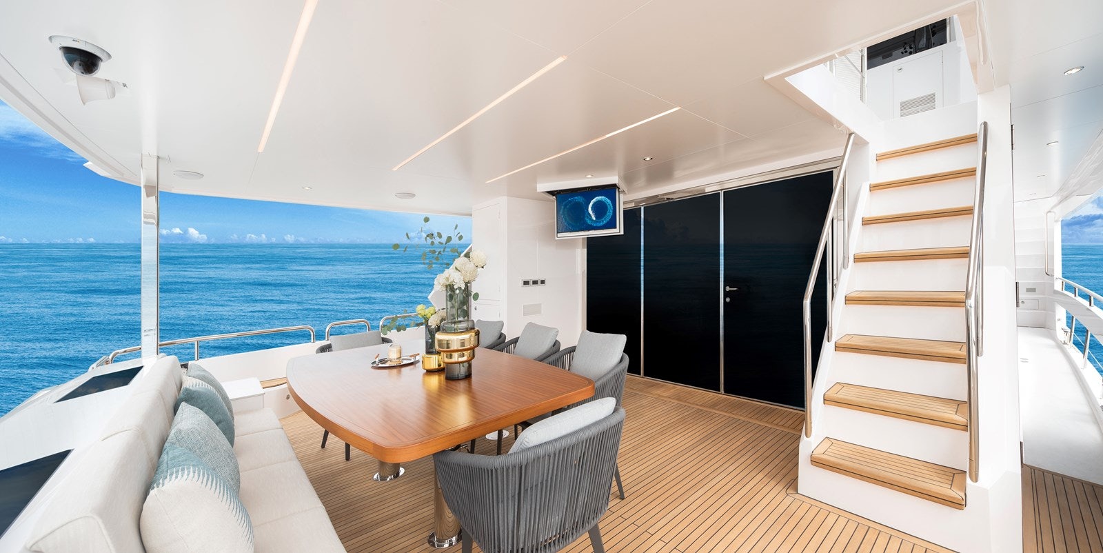 a room with a table chairs and a large window aboard FD80 608 Yacht for Sale