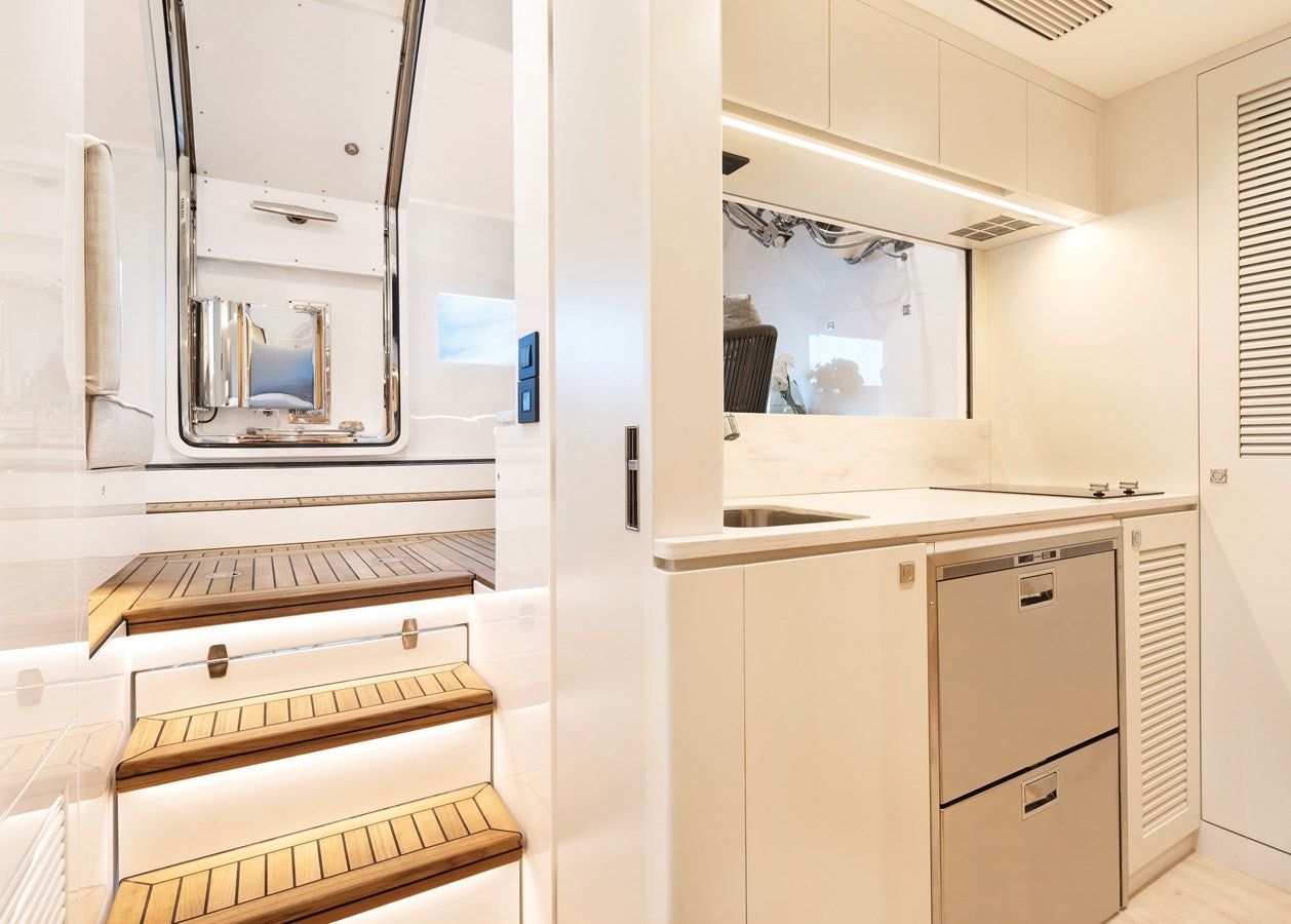 a kitchen with white cabinets aboard FD80 608 Yacht for Sale