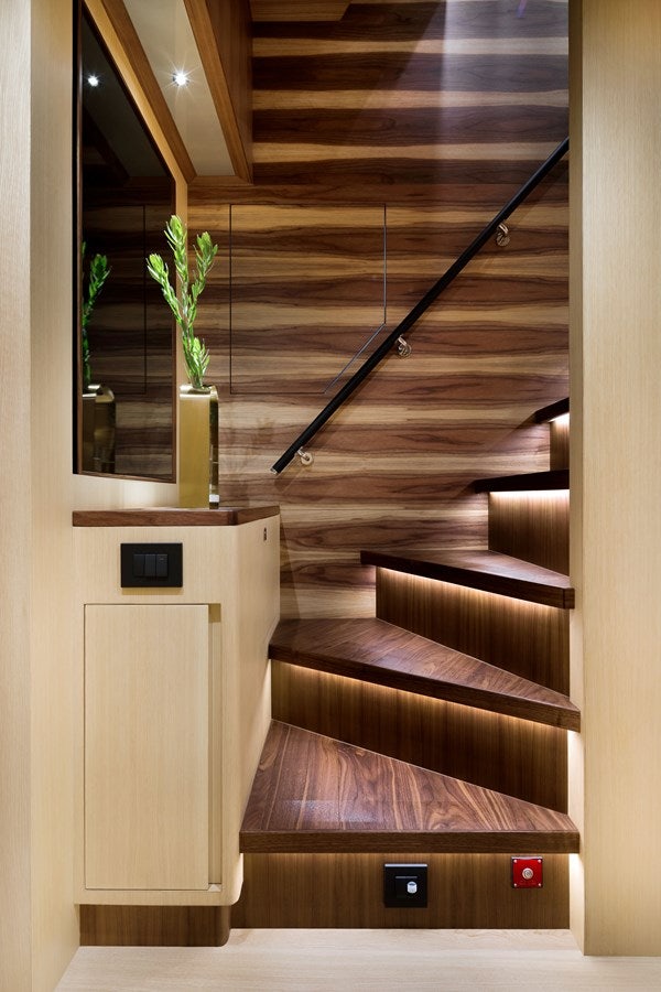 a wooden staircase with a plant on the side aboard FD80 608 Yacht for Sale