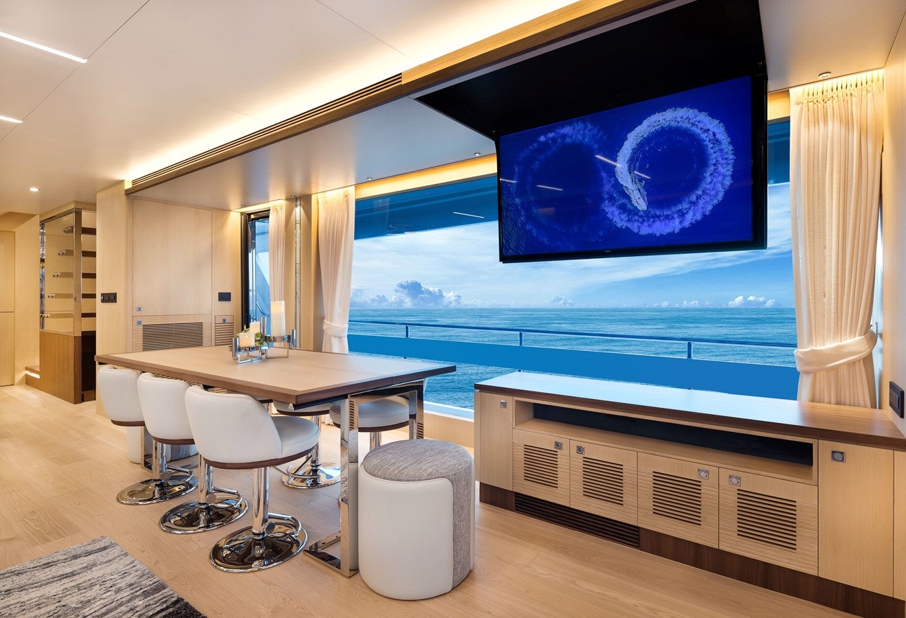 a room with a table and chairs aboard FD80 608 Yacht for Sale