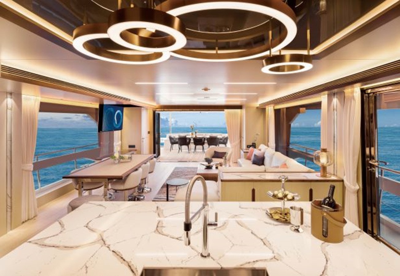 a large room with a table and chairs aboard FD80 608 Yacht for Sale