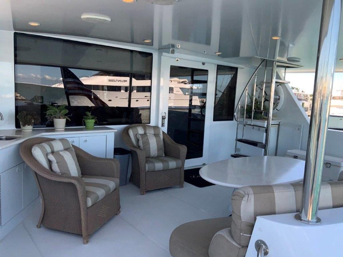 a room with a couch and a table aboard LADY GRACE Yacht for Sale