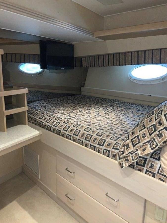a room with a bed and a window aboard LADY GRACE Yacht for Sale