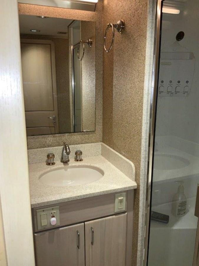 a bathroom with a sink and a mirror aboard LADY GRACE Yacht for Sale