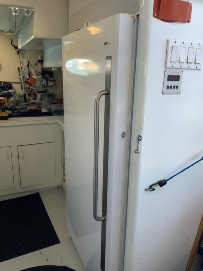 a refrigerator in a kitchen aboard LADY GRACE Yacht for Sale