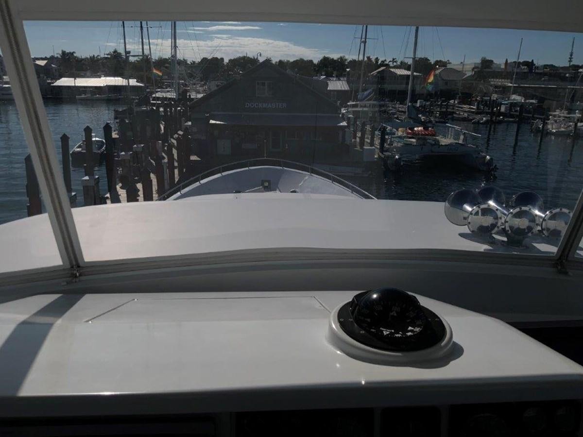 a window with a view of a city and water aboard LADY GRACE Yacht for Sale