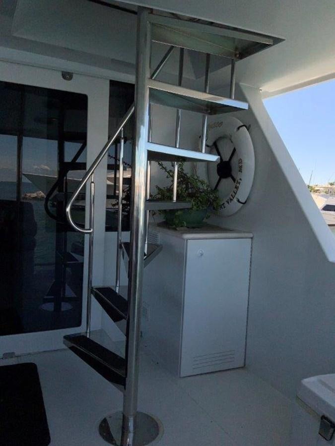 a white cabinet with a vent aboard LADY GRACE Yacht for Sale