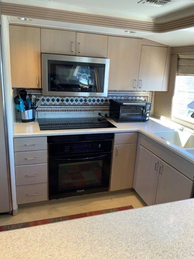a kitchen with a microwave oven aboard LADY GRACE Yacht for Sale