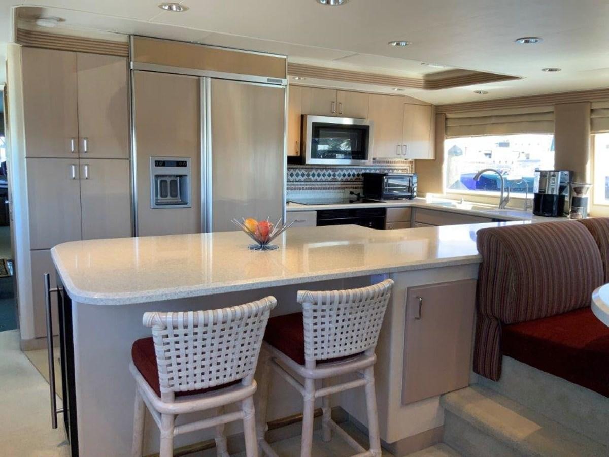 a kitchen with white cabinets aboard LADY GRACE Yacht for Sale