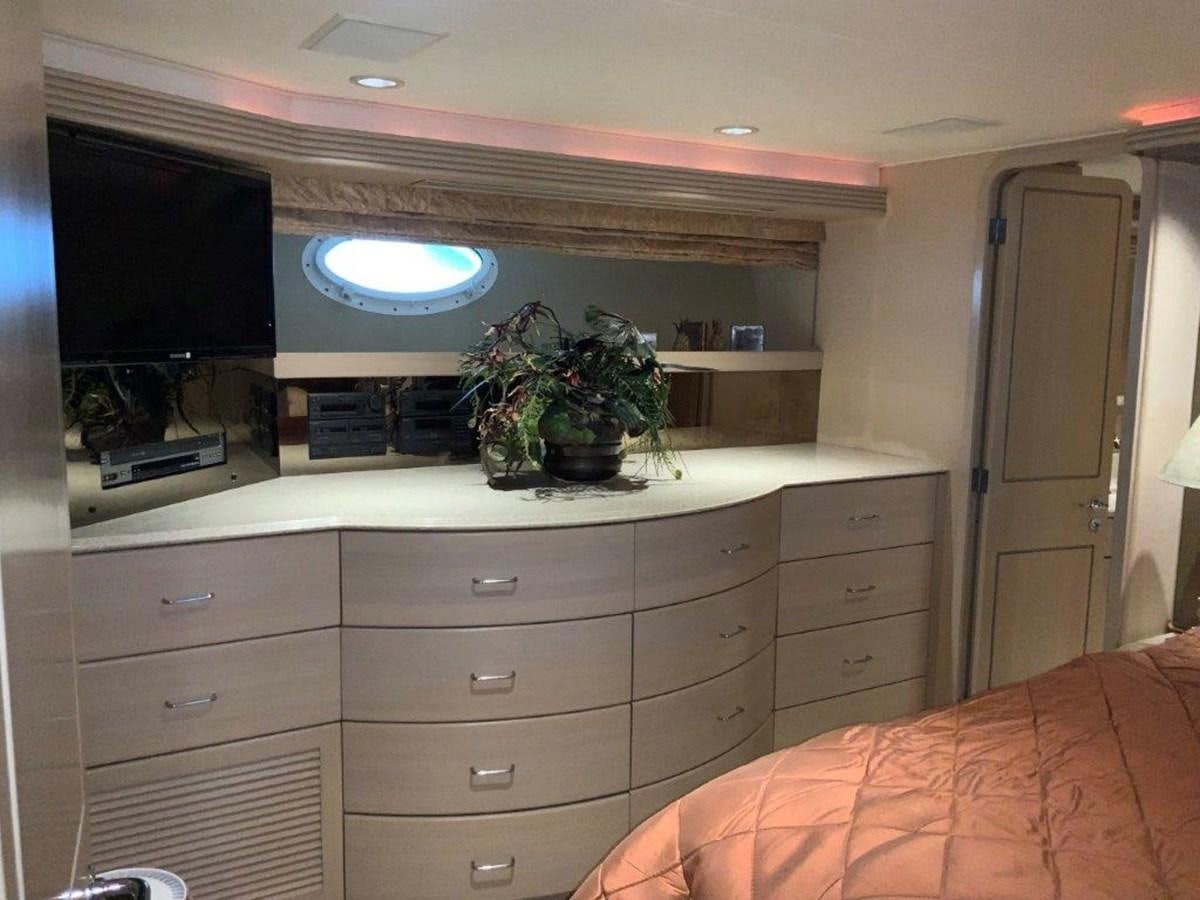 a room with a tv and a bed aboard LADY GRACE Yacht for Sale
