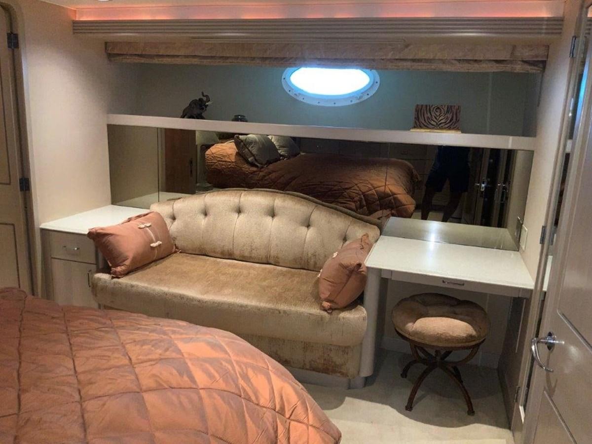 a couple of people sleeping on a couch in a room aboard LADY GRACE Yacht for Sale