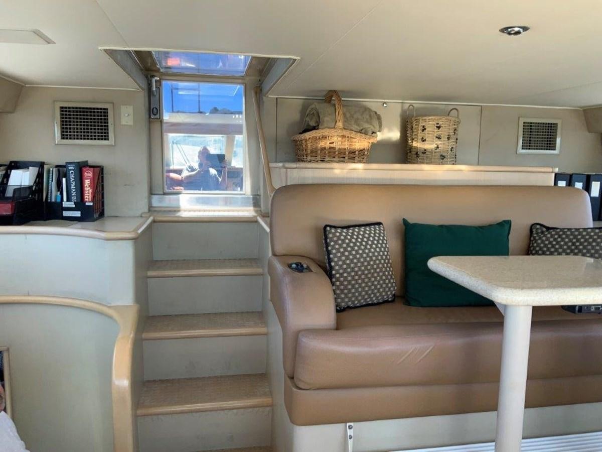 a room with a couch and a table aboard LADY GRACE Yacht for Sale