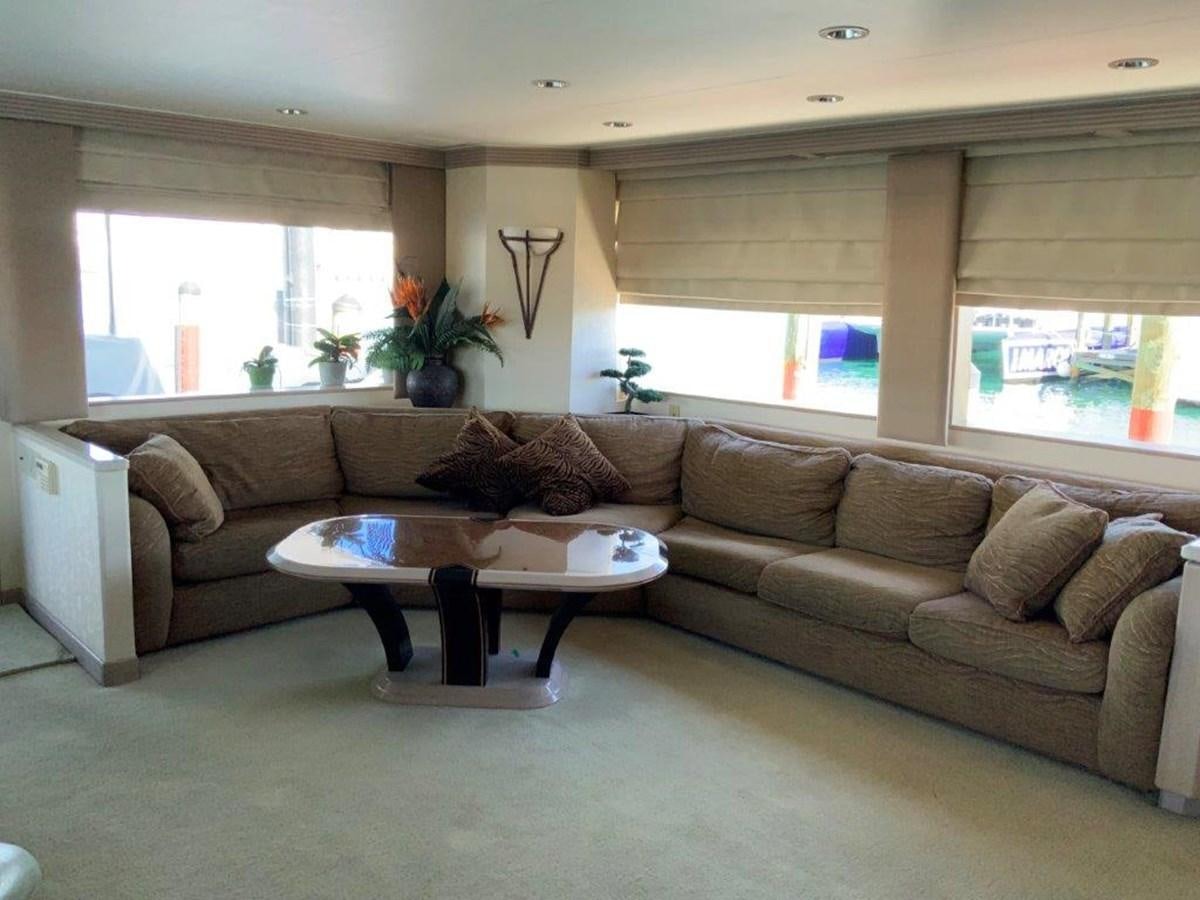 a living room with a couch and coffee table aboard LADY GRACE Yacht for Sale