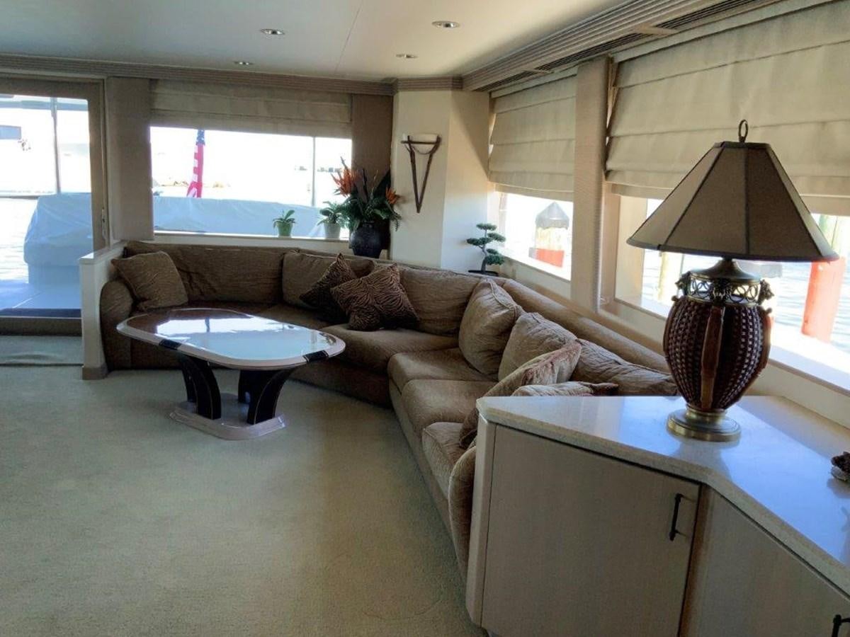 a living room with a couch and a table aboard LADY GRACE Yacht for Sale