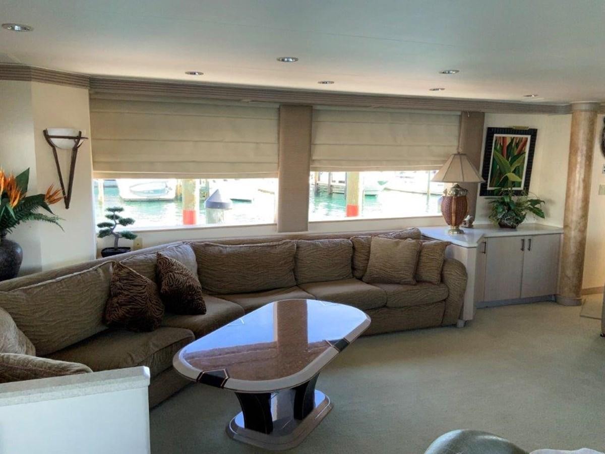 a living room with a couch and a table aboard LADY GRACE Yacht for Sale