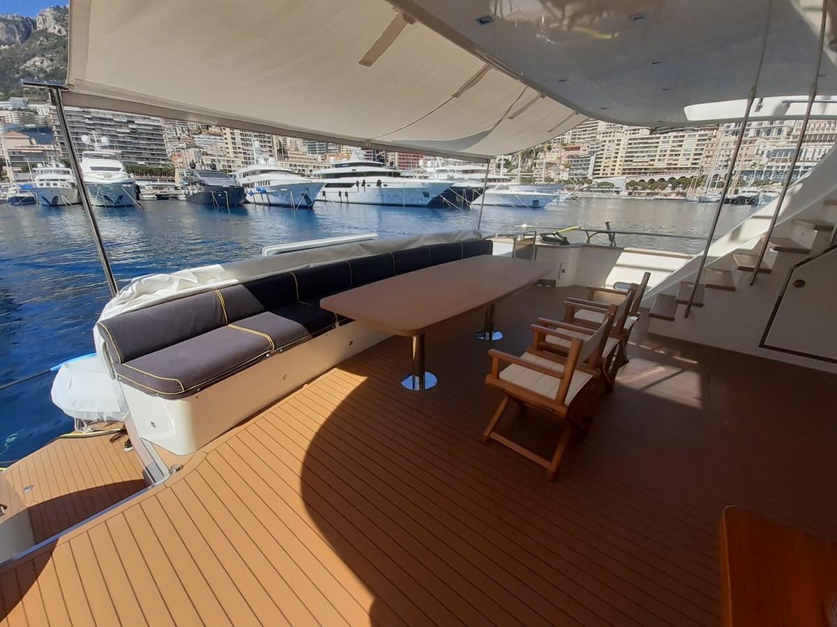 a room with a view of a marina and boats aboard MR. GU Yacht for Sale