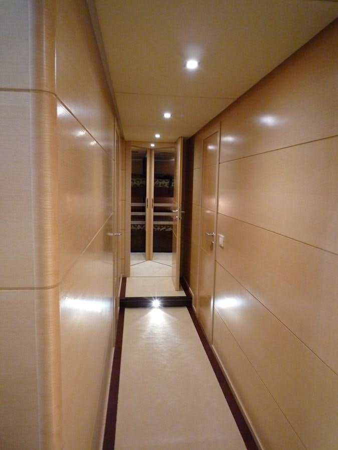 a hallway with doors aboard MR. GU Yacht for Sale