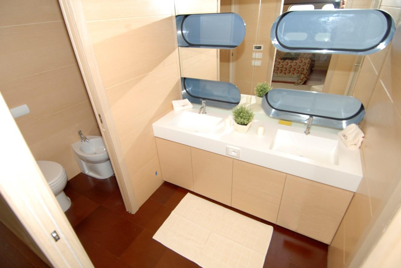 a bathroom with a sink and a toilet aboard MR. GU Yacht for Sale