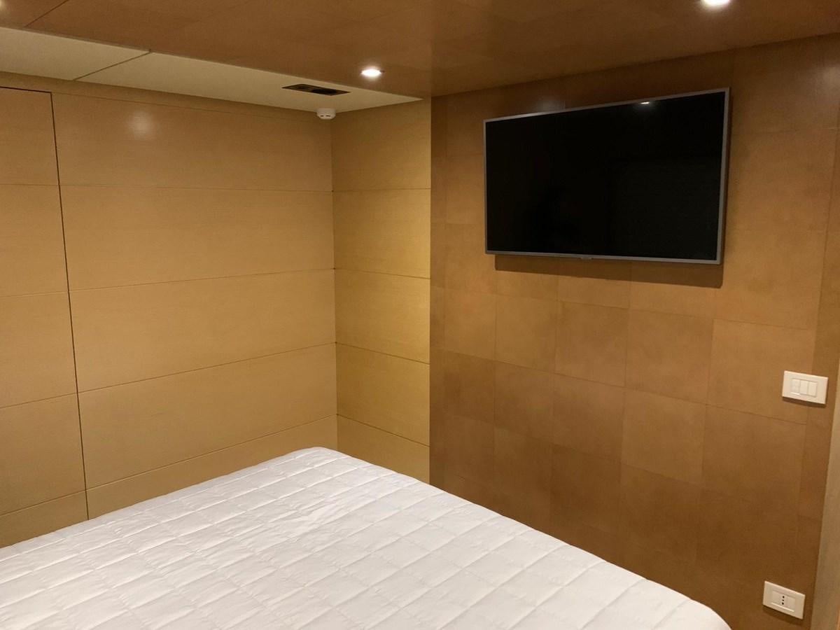 a tv on a wall aboard MR. GU Yacht for Sale