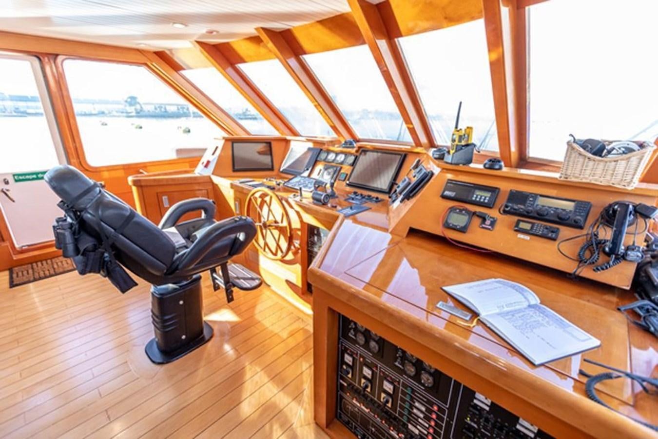 a room with a desk and computer aboard HISTORY Yacht for Sale