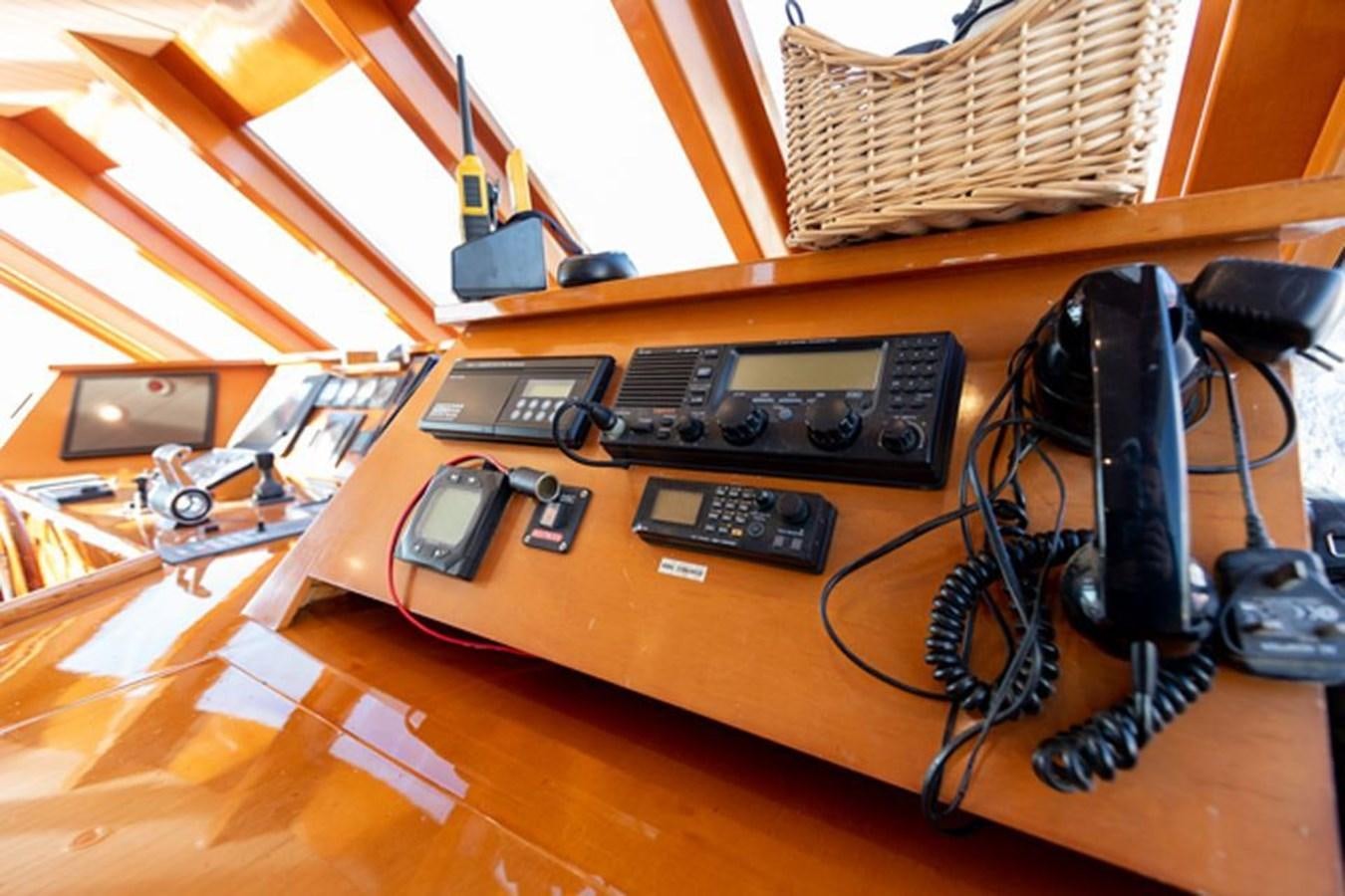 a table with electronics and headphones aboard HISTORY Yacht for Sale
