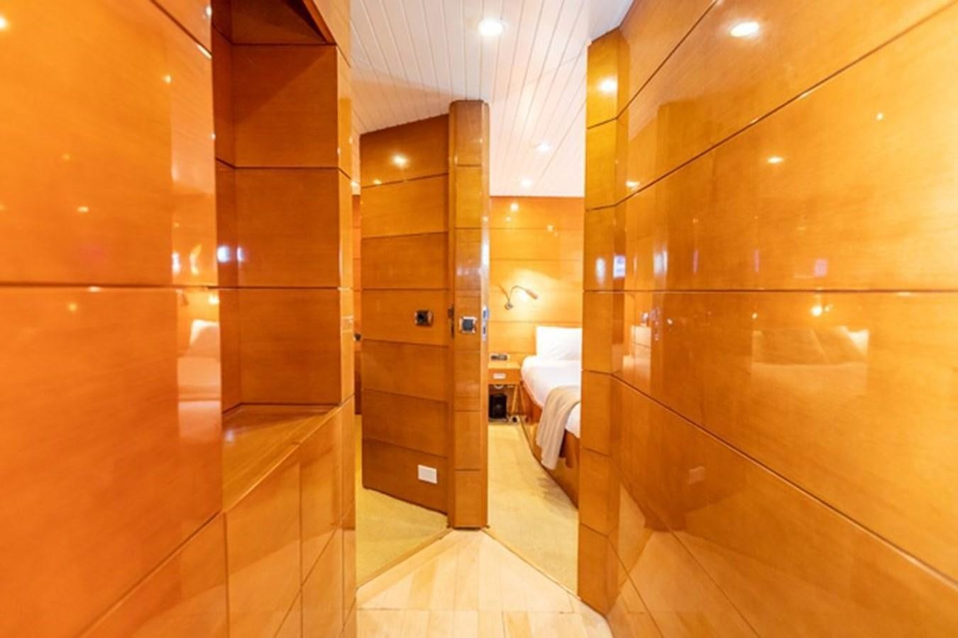 a bathroom with wooden cabinets aboard HISTORY Yacht for Sale