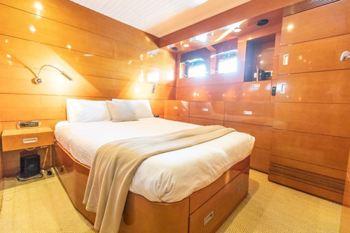 a bed in a room aboard HISTORY Yacht for Sale