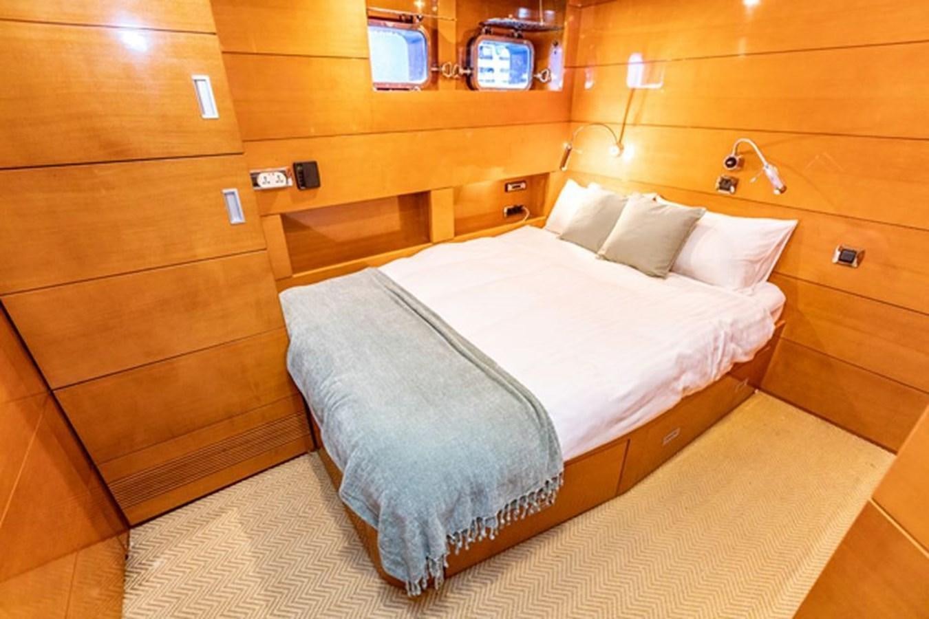 a bed in a room aboard HISTORY Yacht for Sale