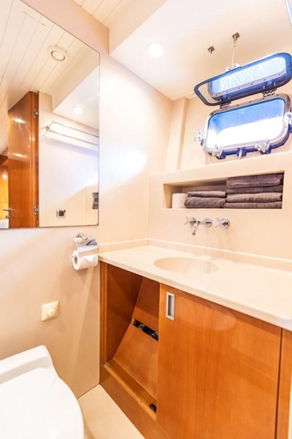 a bathroom with a sink and a mirror aboard HISTORY Yacht for Sale