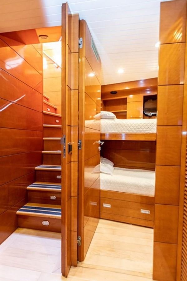 a wooden bunk bed in a room aboard HISTORY Yacht for Sale