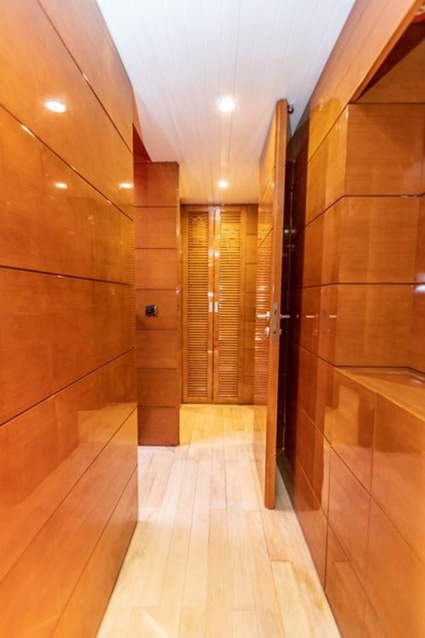 a room with wooden walls and wooden floors aboard HISTORY Yacht for Sale