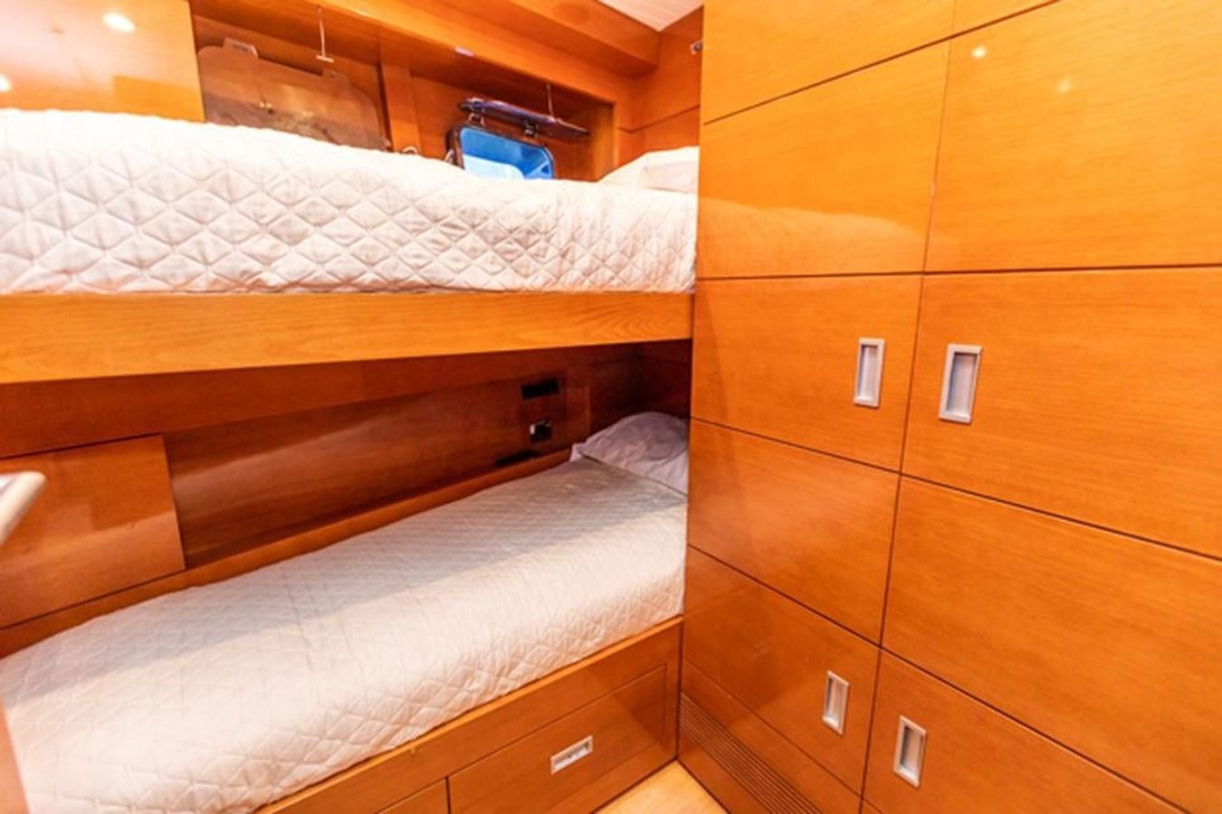 a room with wooden furniture aboard HISTORY Yacht for Sale