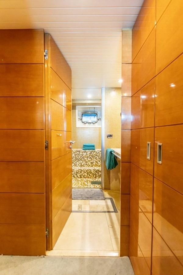 a room with wooden doors aboard HISTORY Yacht for Sale