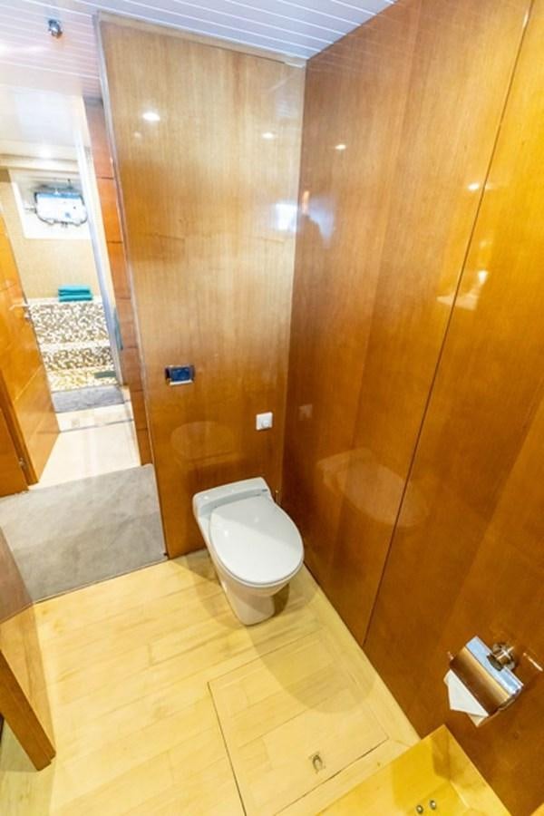 a bathroom with a glass shower aboard HISTORY Yacht for Sale