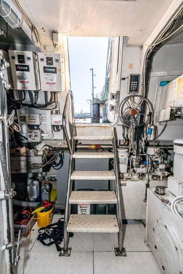 a room with a ladder and equipment aboard HISTORY Yacht for Sale