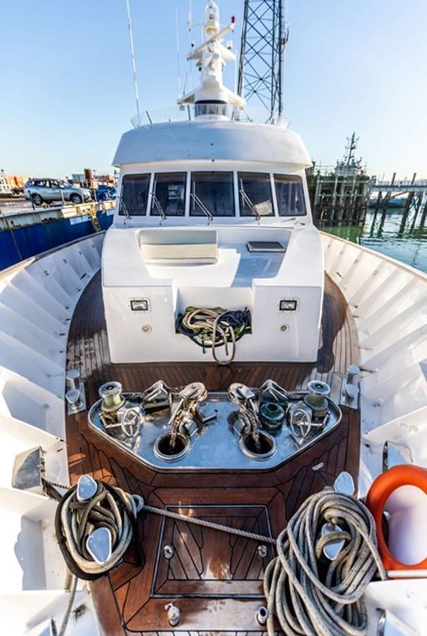 a boat with a large engine aboard HISTORY Yacht for Sale