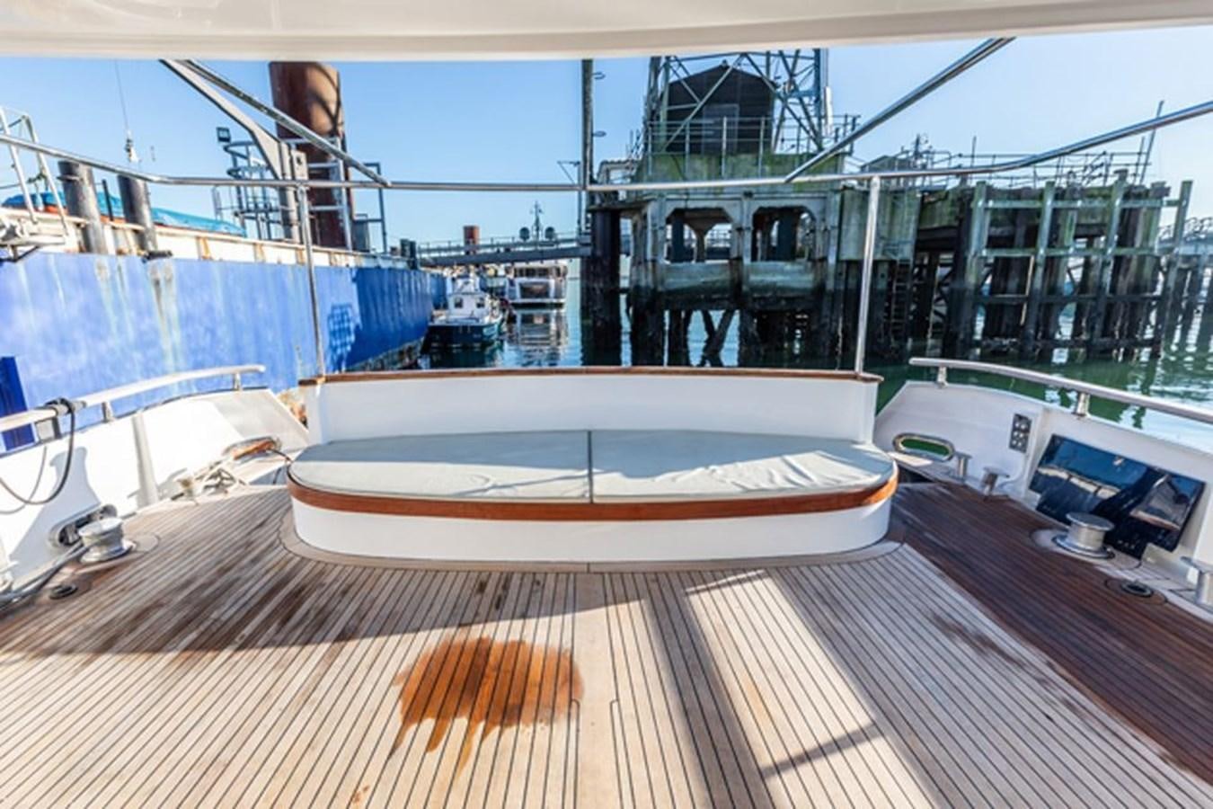 a boat on a deck aboard HISTORY Yacht for Sale
