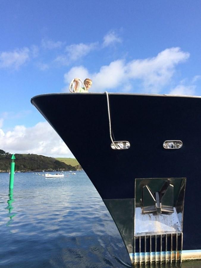 a person jumping out of a boat aboard HISTORY Yacht for Sale