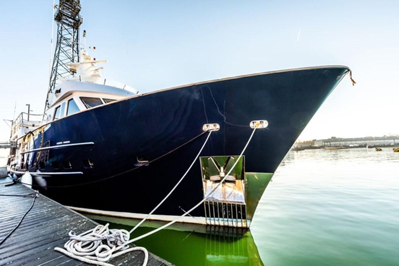 a boat tied to a dock aboard HISTORY Yacht for Sale