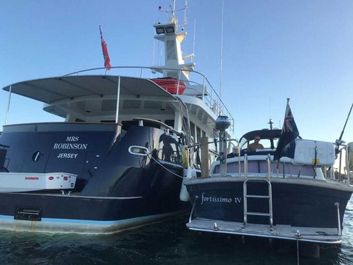 a couple of boats are parked next to each other aboard HISTORY Yacht for Sale