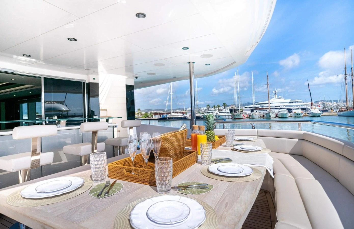 a table with plates and glasses on it aboard QART HADASHT Yacht for Sale